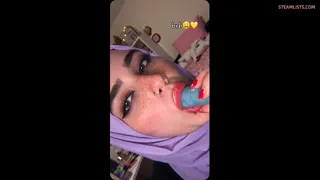 Amateur hijabi sucking a blue dildo